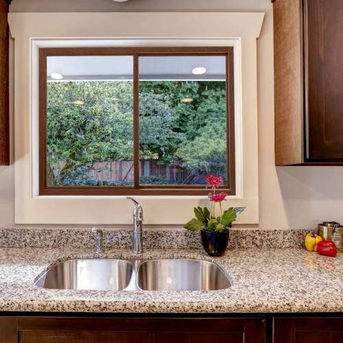 Kitchen cabinet with sink and window view
